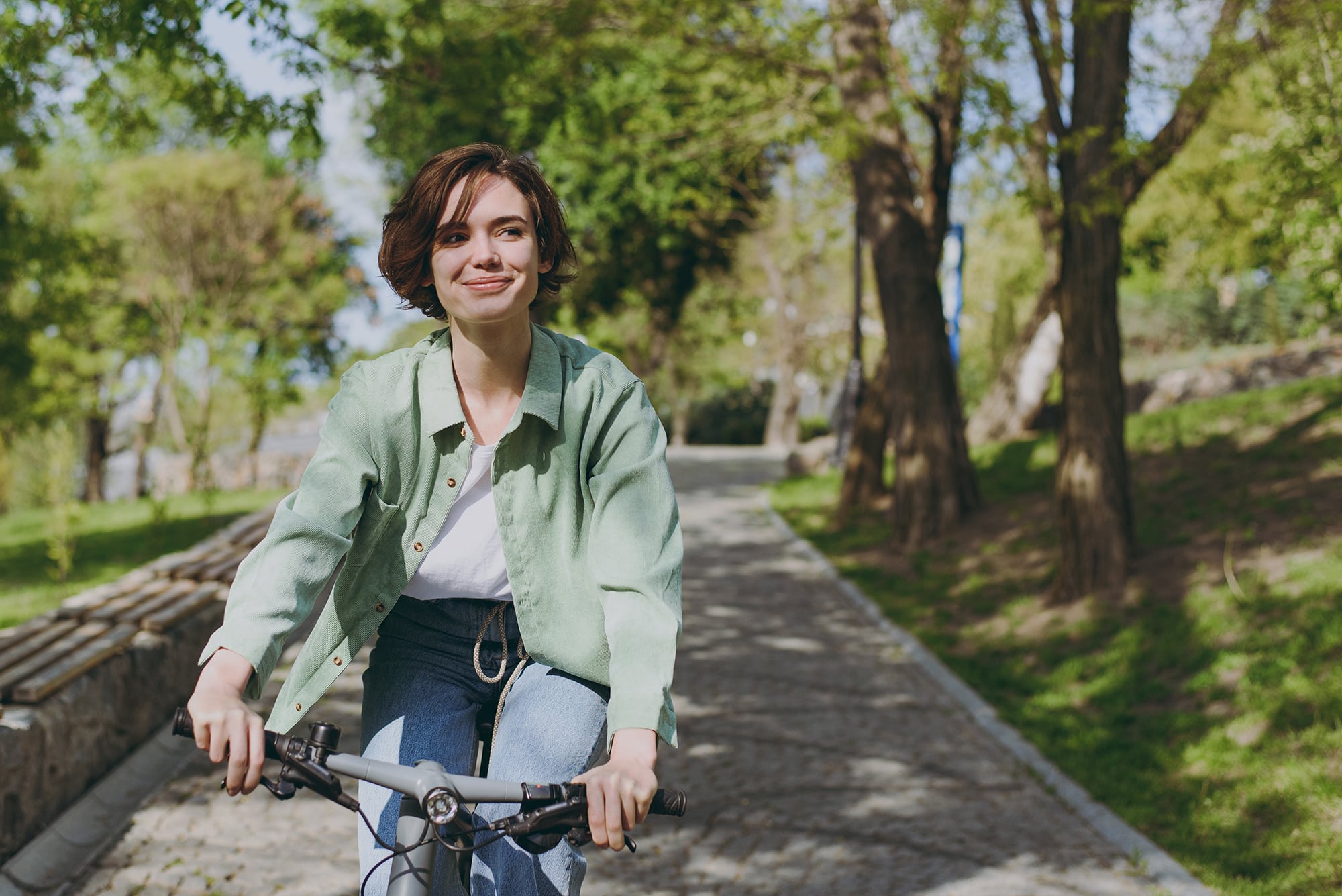 Young woman riding a bike in a park